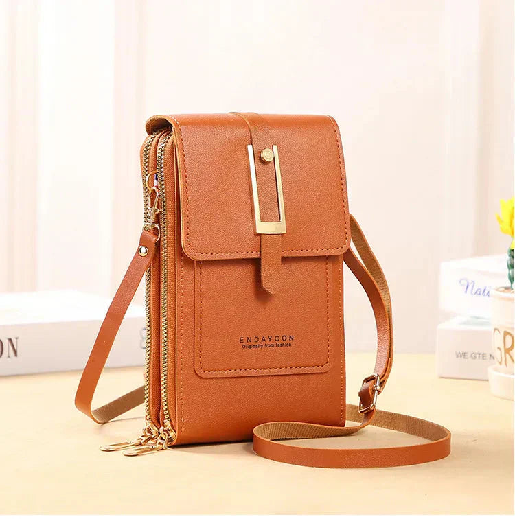 Nielsen™ | Crossbody-tasker med mobiltelefon