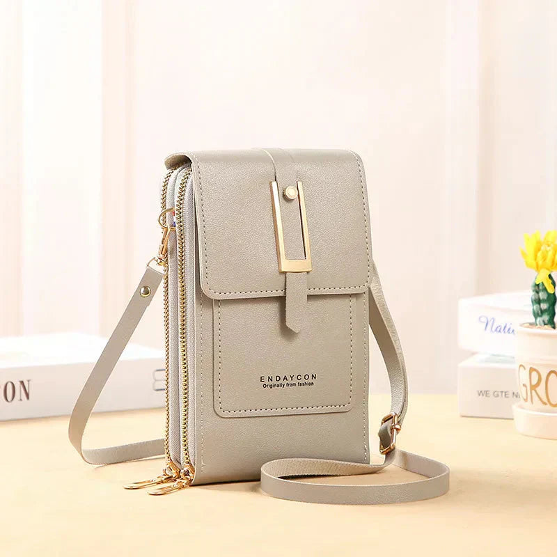 Nielsen™ | Crossbody-tasker med mobiltelefon